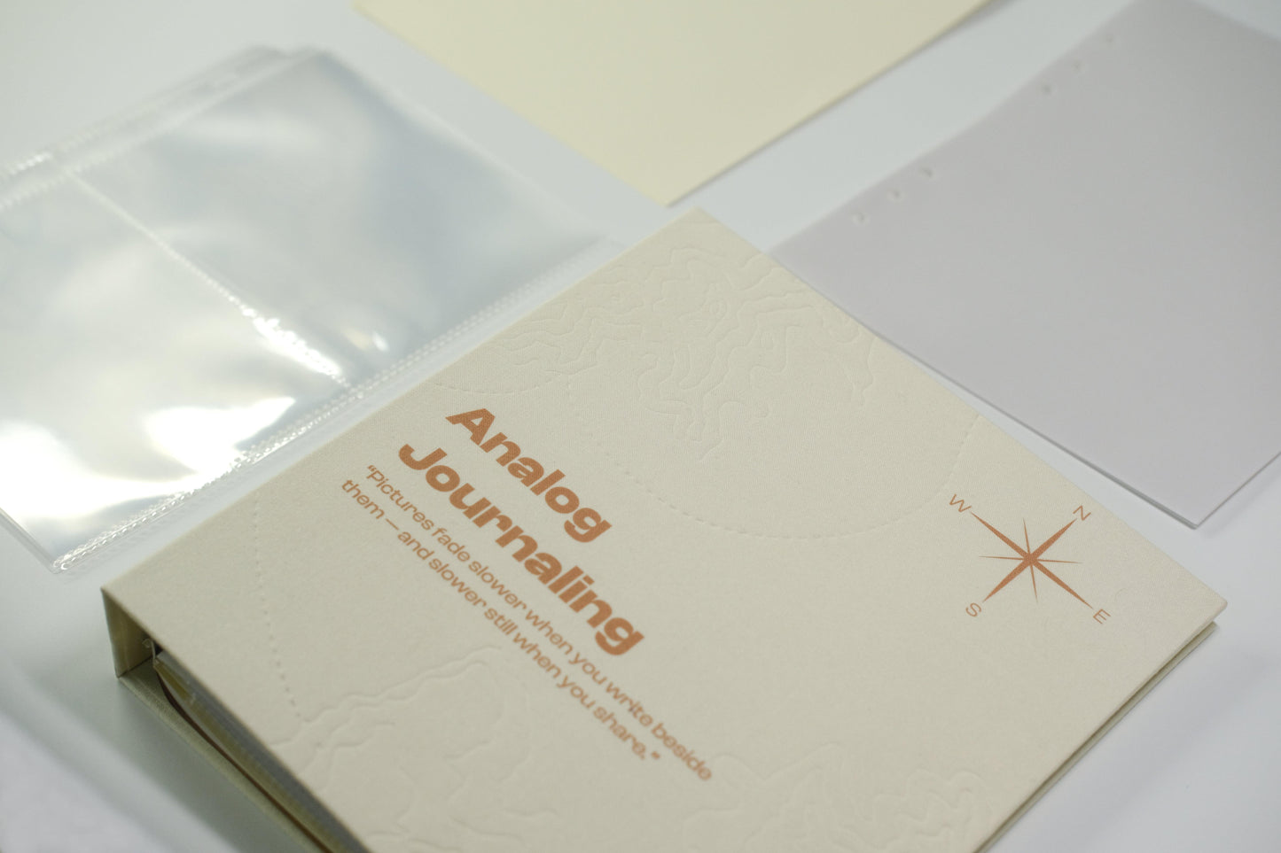 PostRush Analog Journaling binder with translucent refill pocket pages on a white background.