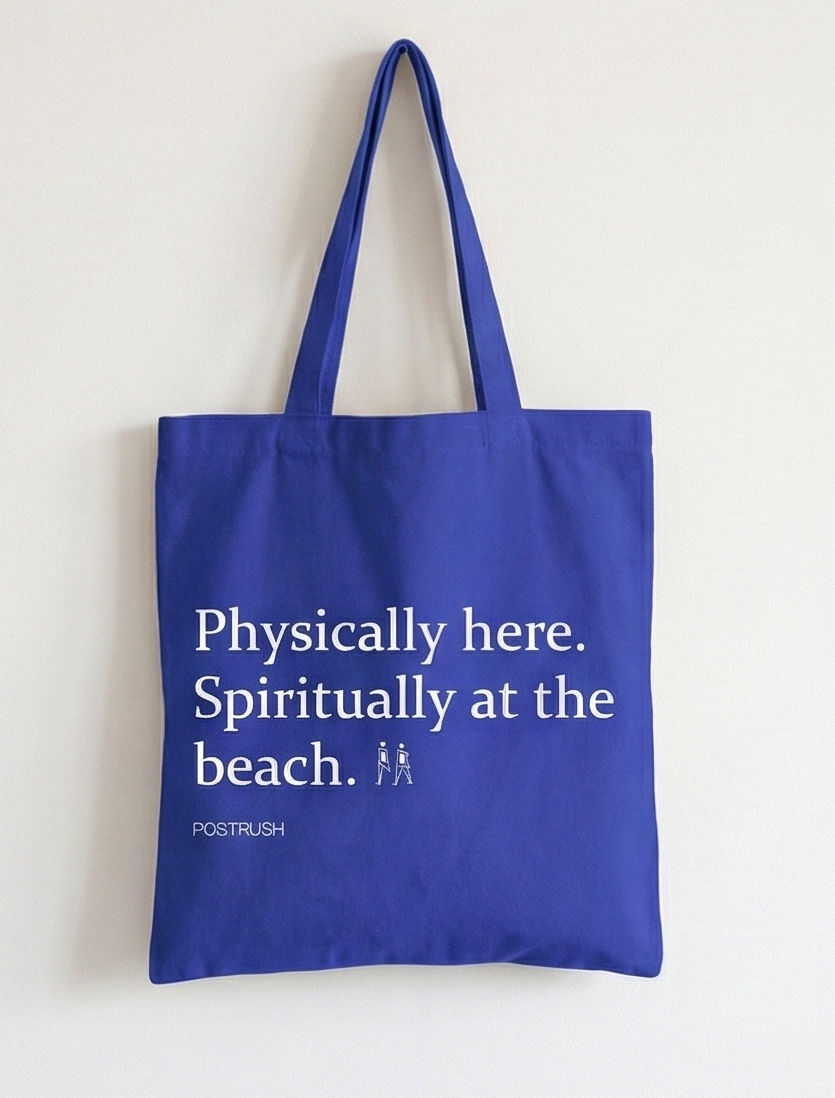 Blue tote bag with humorous text on a white background