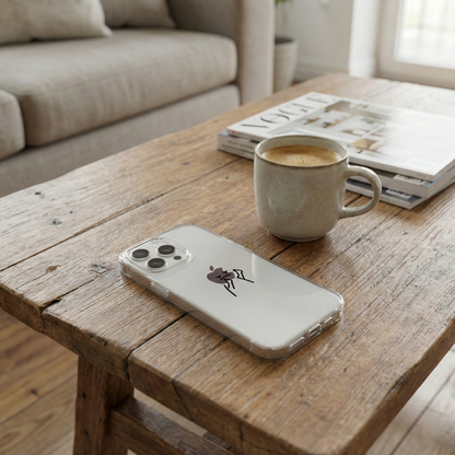 Clear phone case on a wooden coffee table next to a coffee mug and magazines.