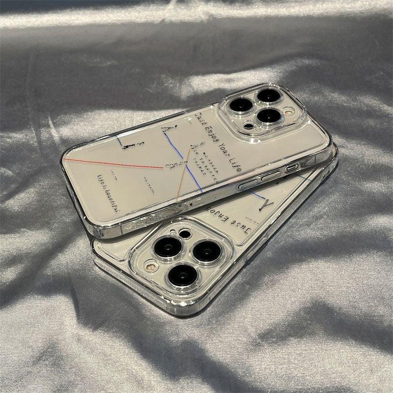 Two clear phone cases stacked on a soft fabric surface, featuring the text “Just Enjoy Your Life” with minimalist line illustrations and colored lines.