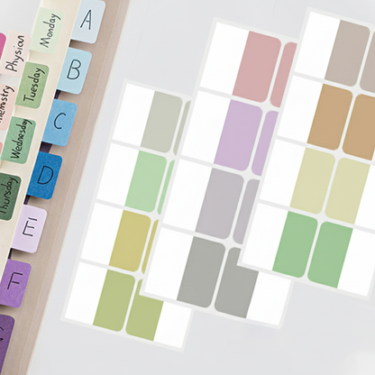Colorful labeled tabs on a planner with a grid of color swatches.