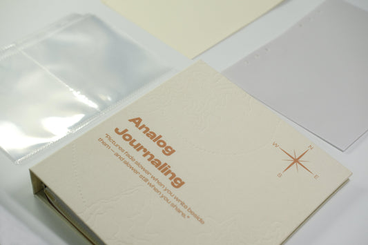 PostRush Analog Journaling binder with translucent refill pocket pages on a white background.